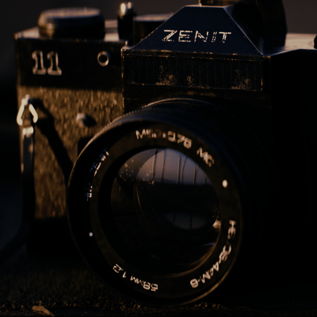Highly detailed 3D render of a vintage Zenit analog camera with lens and strap